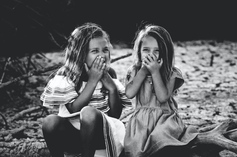 little girls giggling together