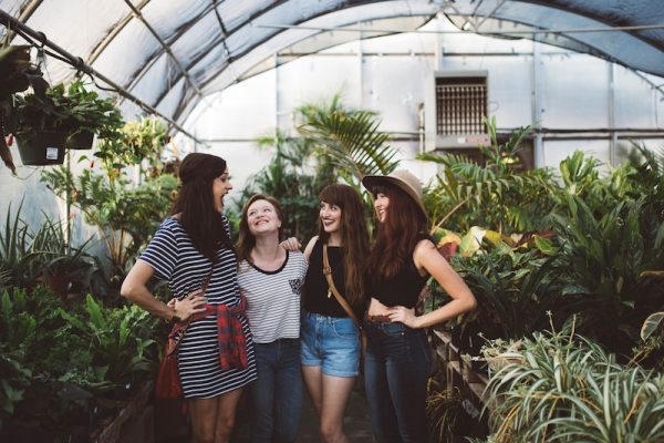 friends in a green house